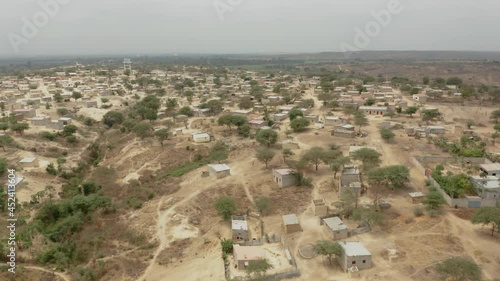 Angola, Flying over a small adobe village, Caxito, Bengo, Africa photo