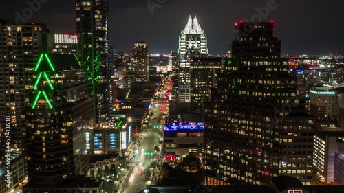 Wallpaper Mural Aerial Hyperlapse of Downtown Austin at night revealing Capitol building over Congress Avenue with city traffic and tall buildings passing by. Torontodigital.ca
