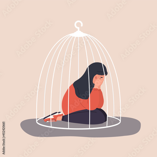 Muslim woman locked in cage. Sad teenager sitting on floor and crying. Social isolation concept. Female empowerment movement. Violence in family. Vector illustration in cartoon style.