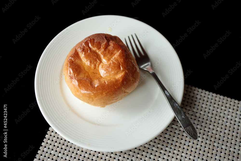 Baked bread topped with oil in a white plate Baked bread topped with oil in a white plate