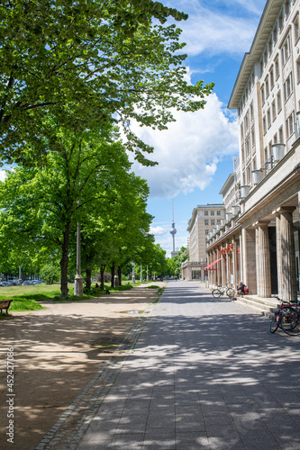 Canvas Print pathway with trees in berlin, karl-marx-allee, blue sky