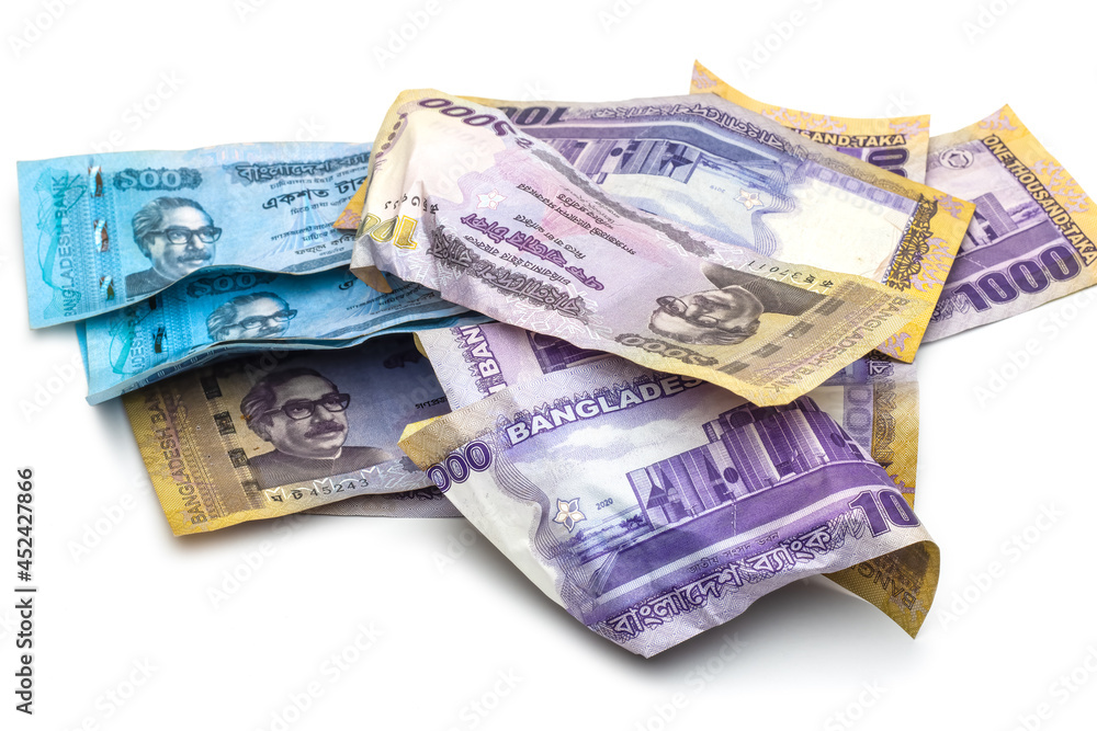 A bunch of scattered and wrapped one thousand taka bangladesh banknotes on white background A bunch of scattered and wrapped one thousand taka bangladesh banknotes on white background