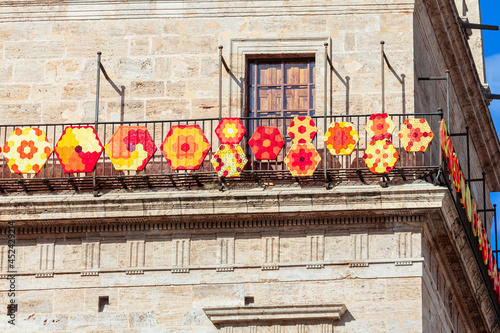 Street decoration on the balcony in Valencia city . Spanish embroidery decoration . Handmade fancywork exterior ornate 