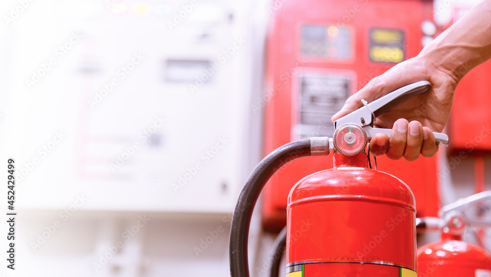 Close up Fire extinguisher and pulling pin on red tank. Close up Fire extinguisher and pulling pin on red tank.