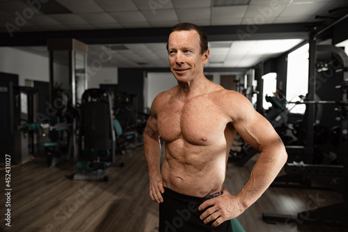 Portrait of a senior muscular man in a gym