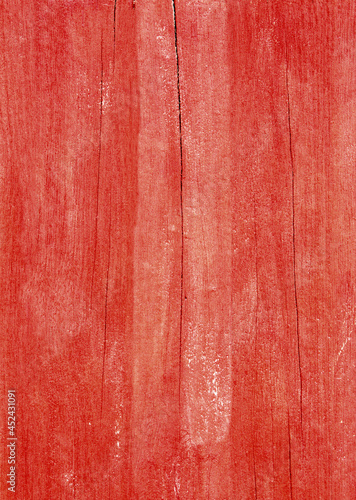 Texture of wooden plank painted with red paint