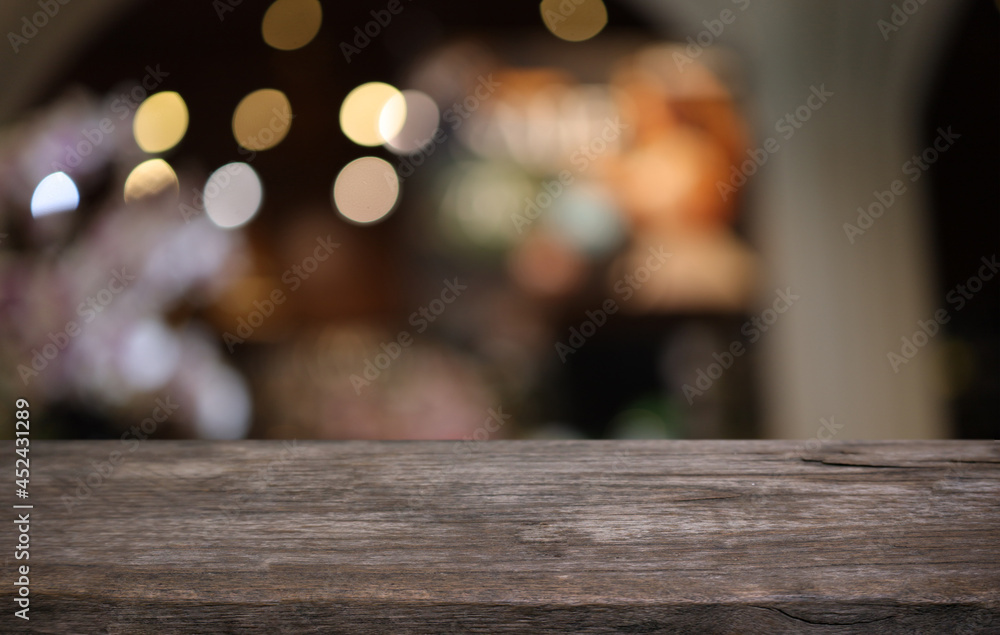 Empty wooden table in front of abstract blurred background of coffee shop . can be used for display or montage your products.Mock up for display of product