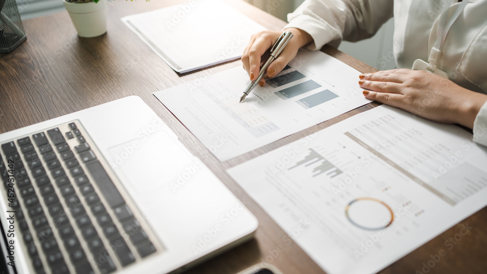 Auditor or internal revenue service staff, Business women checking annual financial statements of company. Audit Concept. Auditor or internal revenue service staff, Business women checking annual financial statements of company. Audit Concept.