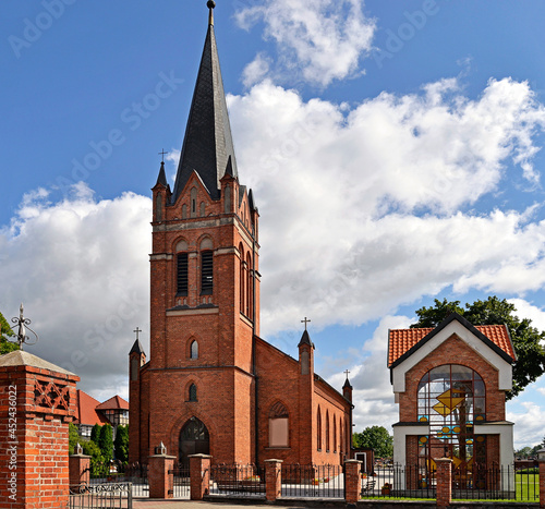 General view and architectural details of the Catholic Church of the Exaltation of the Holy Cross built in 1861 in the neo-Gothic style in the city of Olecko in Masuria, Poland.