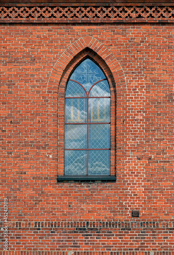 General view and architectural details of the Catholic Church of the Exaltation of the Holy Cross built in 1861 in the neo-Gothic style in the city of Olecko in Masuria, Poland.