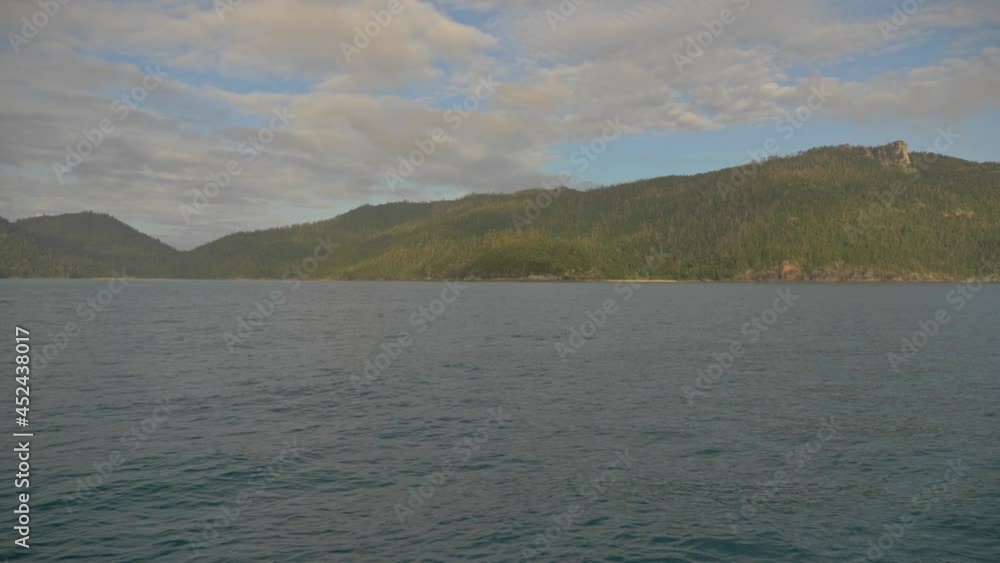 View From The Water Of Nara Inlet In Hook Island, Whitsundays, QLD, Australia In Daylight. wide shot View From The Water Of Nara Inlet In Hook Island, Whitsundays, QLD, Australia In Daylight. wide shot