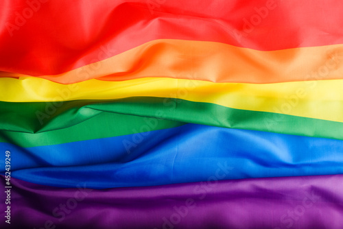 Top view rainbow flag background, international symbol of LGBT community, sign of diversity and gender equality in rights.