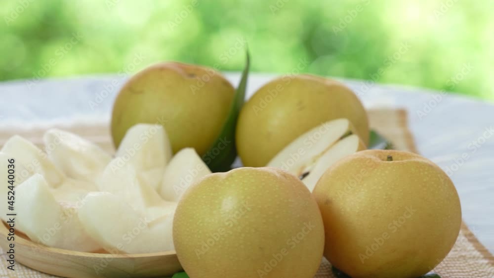 Fresh Snow pear fruit on blurred greenery background, Fresh Japanese Kumamoto pear fruit on natural farm. Fresh Snow pear fruit on blurred greenery background, Fresh Japanese Kumamoto pear fruit on natural farm.