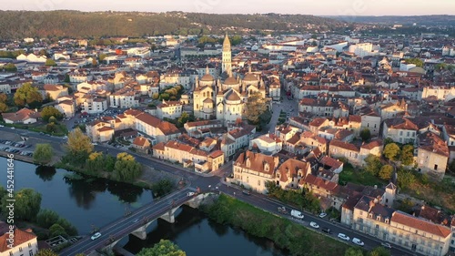 Drone view of French city of Perigueux on Isle River overlooking Romanesque building of ancient cathedral during summer sunrise, Dordogne photo