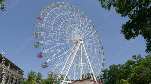Krasnodar, Russia, 07.19.2021, Ferris wheel attraction in the city park 