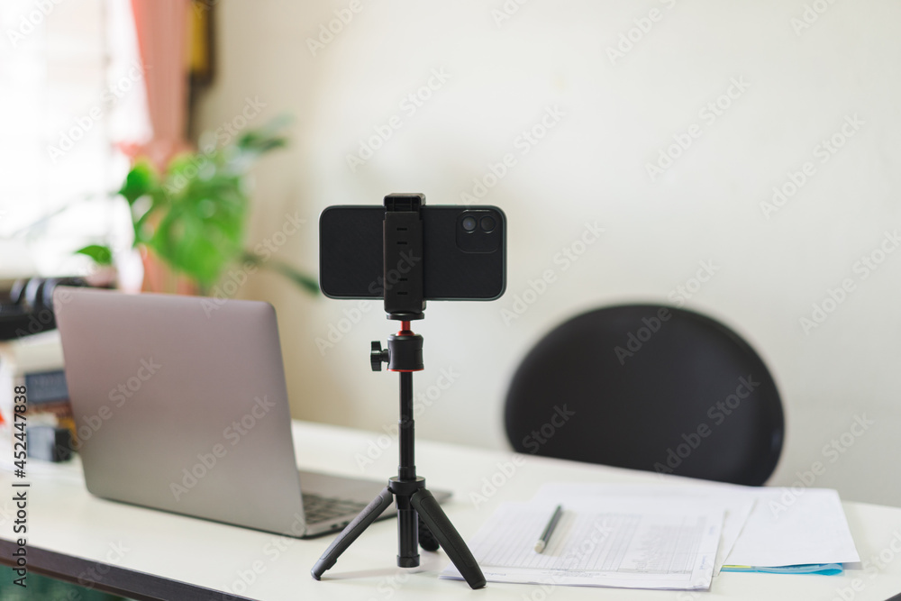 Naklejka premium Student studying table and workplace with laptop and notebook in home office during COVID-19 pandemic
