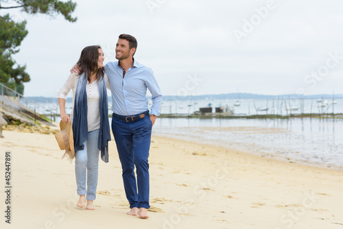 a couple walking on beach