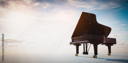 Grand piano on blue sky background