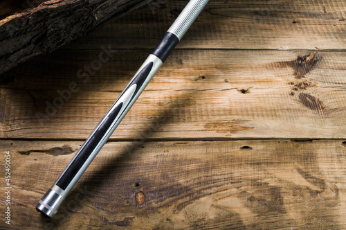 Float fishing rod on a wooden background. Fishing rod on a wooden platform.