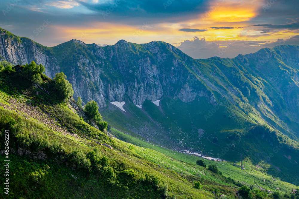  Beautiful sunset in a green mountain valley, background with nature