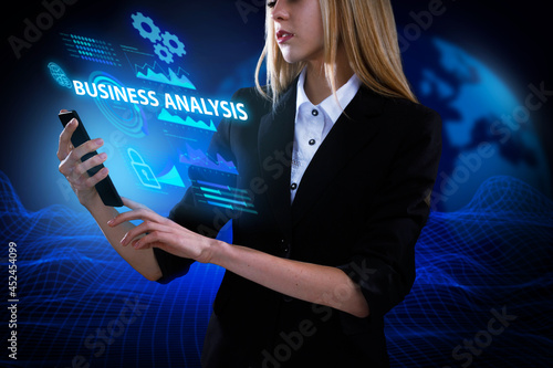 Business, Technology, Internet and network concept. Young businessman working on a virtual screen of the future and sees the inscription: Business analysis