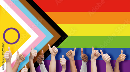 Canvas Print lgbtq, trans and intersex rights concept - multiracial human hands showing thumb
