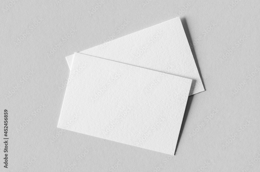Textured business card mockup on a grey background. 85x55 mm. Textured business card mockup on a grey background. 85x55 mm.