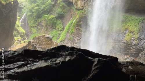 The beautiful Barglistuber Waterfall in Glarus, Switzerland photo