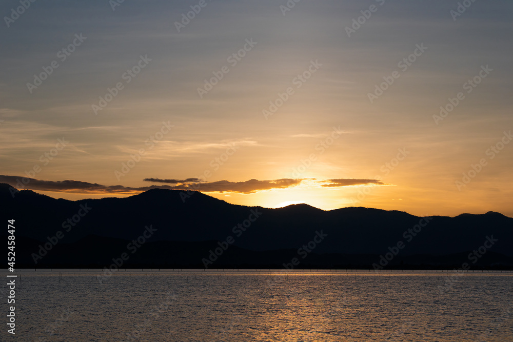 Natural scenery of sunset and mountains with the river in the evening, Phayao, Thailand
