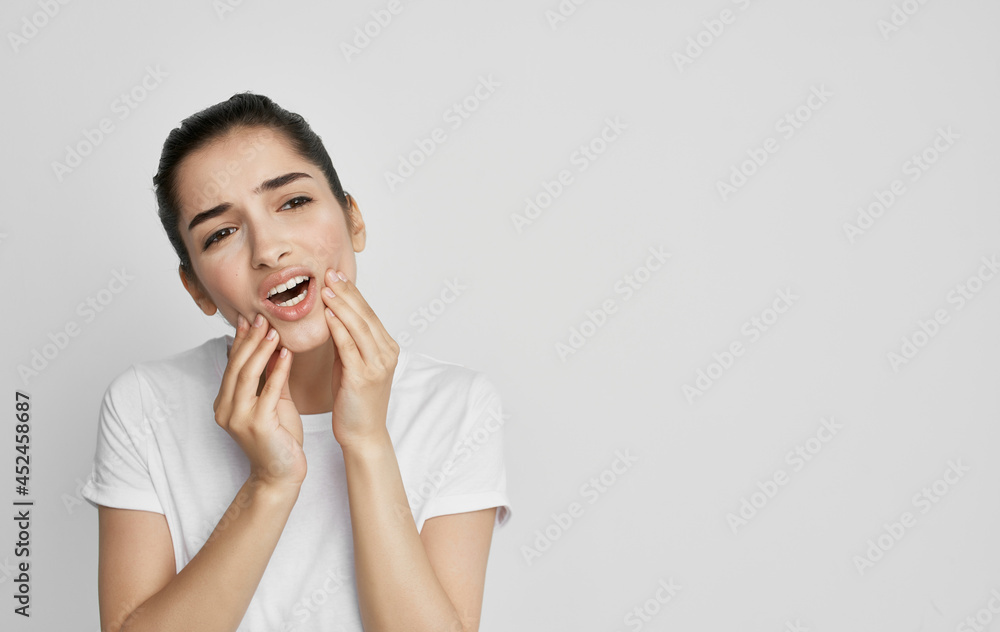 woman with toothache in white t-shirt dissatisfaction health problems woman with toothache in white t-shirt dissatisfaction health problems