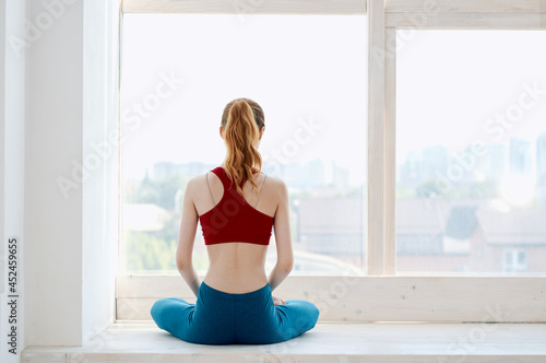 woman sitting near the window yoga workout harmony Free Download woman sitting near the window yoga workout harmony - GFXLoad