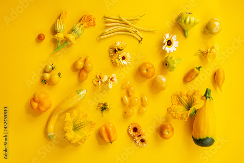Yellow vegetables on the yellow background