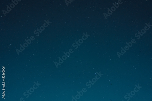 Starry night sky with many stars on blue background
