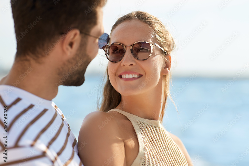 leisure, relationships and people concept - portrait of happy couple on summer beach leisure, relationships and people concept - portrait of happy couple on summer beach