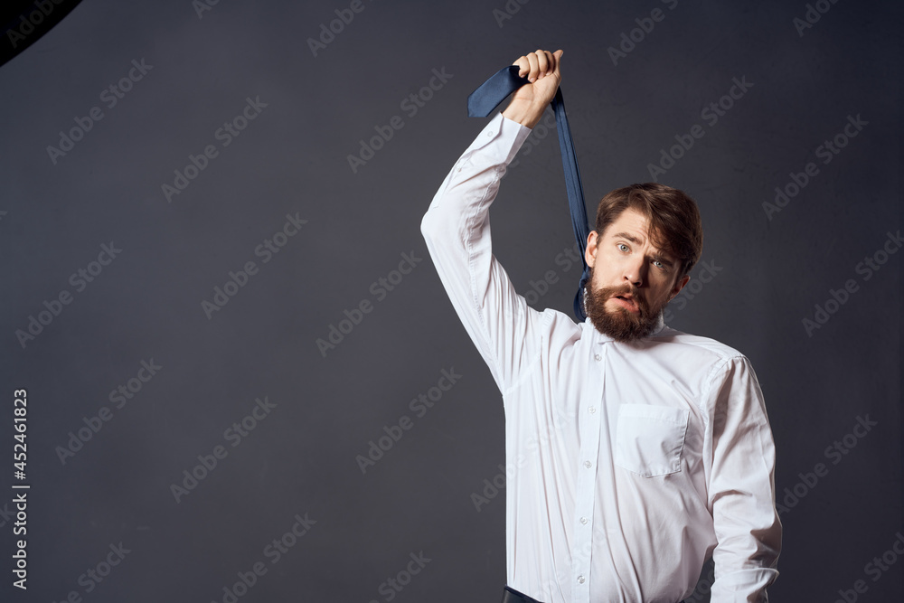 businessmen holding a tie executive office dark background businessmen holding a tie executive office dark background