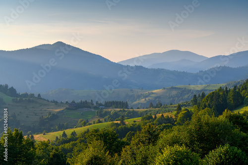 Amazing mountain landscape with colorful vivid sunset on the cloudy sky