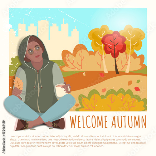 African american man sitting with a drink in the hood against the background of the autumn forest
