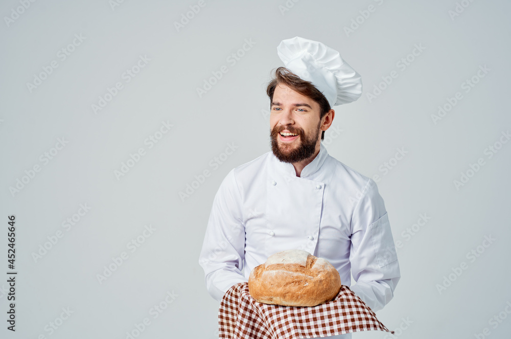 male cook with bread in hand culinary industry male cook with bread in hand culinary industry
