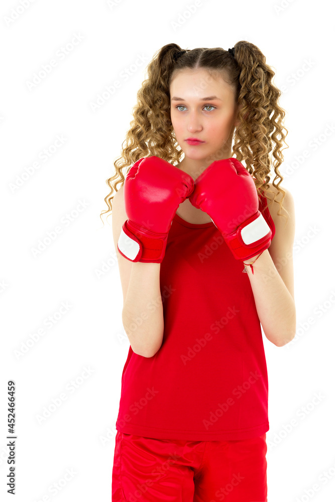 Fototapeta premium Teen blonde girl fighting in red boxing gloves