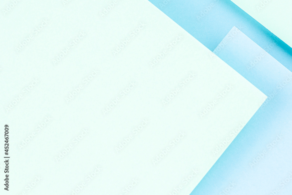 Abstract colored paper texture background. Minimal geometric shapes and lines in pastel green and light blue colours Abstract colored paper texture background. Minimal geometric shapes and lines in pastel green and light blue colours