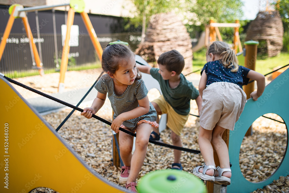 Photo Art Print Group of small nursery school children playing outdoors on playground Halfpoint