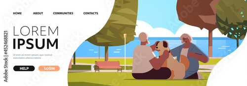 senior couple spending time with dog in urban park relaxation retirement concept full length