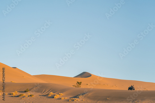 The sunset view of the dunes in deserts in Dunhuang  China.