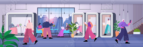 businesspeople working in protective glass cabins business people team in modern office