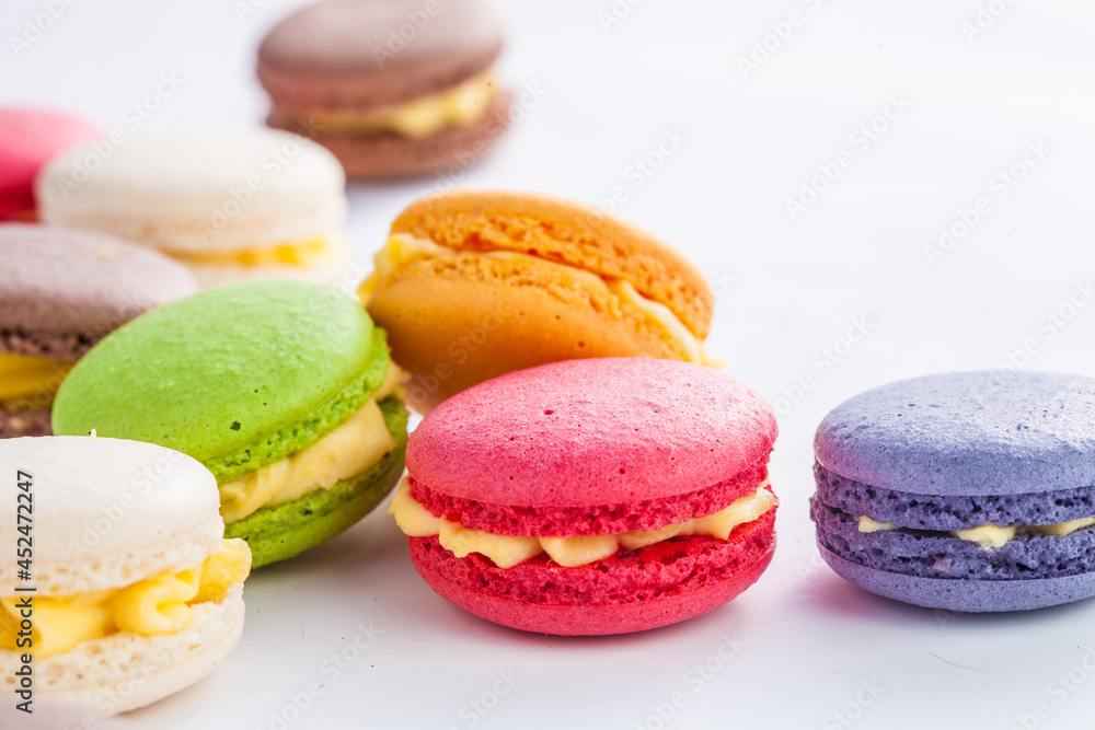 many macaroons on white table