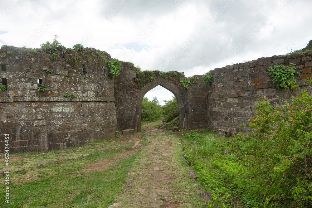 Old fallen entry gate of Dhodap fort, Nashik, Maharashtra, India.