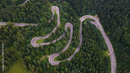 Overhead 4K drone clip  over a winding road on the mountainous area of Busteni,Transylvania, Romania photo