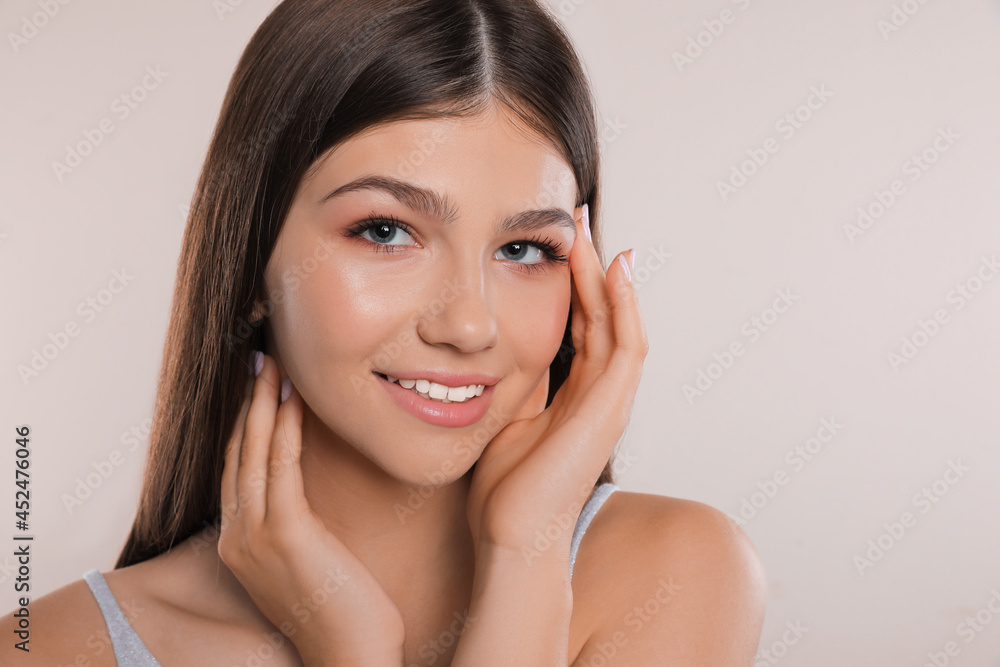 Pretty girl on light background. Beautiful face with perfect smooth skin Pretty girl on light background. Beautiful face with perfect smooth skin