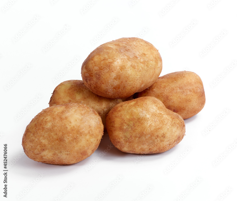 Potato on white background. Soft light. Nobody Potato on white background. Soft light. Nobody