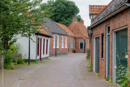 Street view of Winsum a small town in the northern of Holland, Architecture traditional houses, The village in the Dutch municipality of Het Hogeland in the province of Groningen, Netherlands. photo